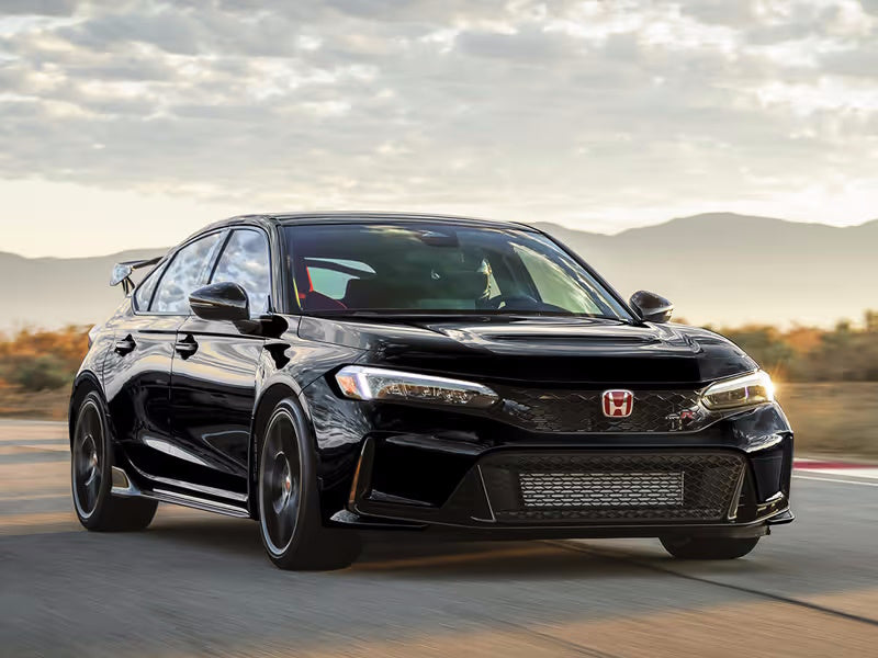 Black Honda Civic Type R car on a road.