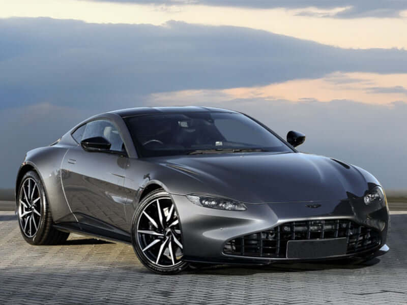 Gray sports car parked outdoors.